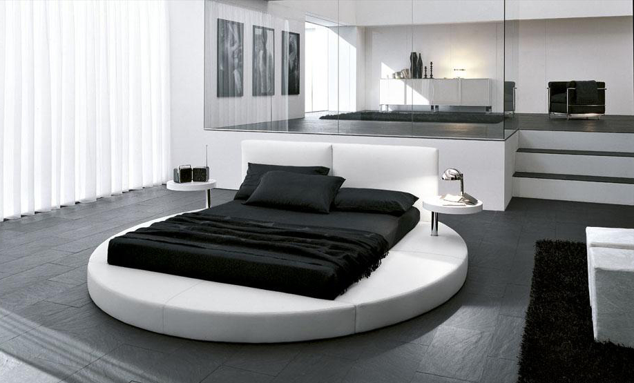 Круглая кровать в современном дизайне спальни-гостиной