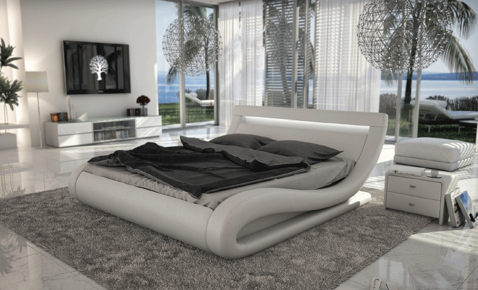 Кровать в плавных формах в спальне в современном стиле