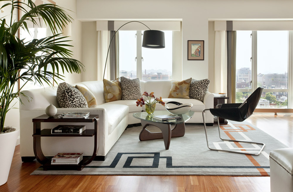 Для комнаты в стиле модерн лучше выбрать днотонный ковр с неким авангардистским символом либо геометрическим узором
